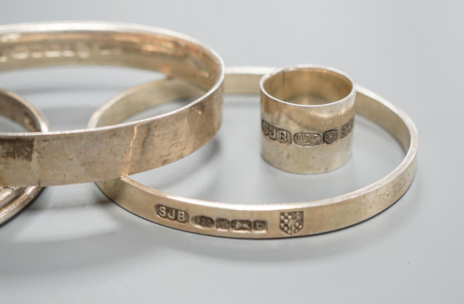 Three modern silver bangles and a large silver band, all by Simon J. Beer of Lewes,191 grams, ring - Image 3 of 5