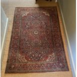 A fine Isphahan red ground rug, with central floral medallion, multi-bordered, 197 x 129cm