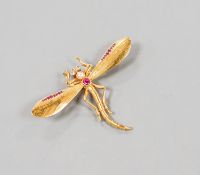 A yellow metal, ruby diamond and cultured pearl set dragonfly brooch, diameter 52mm, gross weight