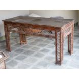 A bamboo and rattan centre table, with black lacquered top, width 166cm depth 76cm height 86cm