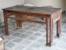 A bamboo and rattan centre table, with black lacquered top, width 166cm depth 76cm height 86cm