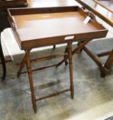 A late Victorian oak butler's tray on folding stand, width 62cm, depth 42cm, height 80cm