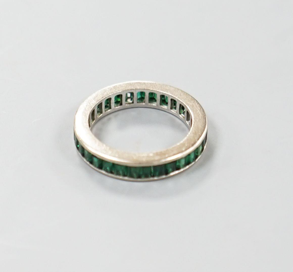 A white metal and green garnet? set full eternity ring, size L, gross weight 3.3 grams. - Image 3 of 3