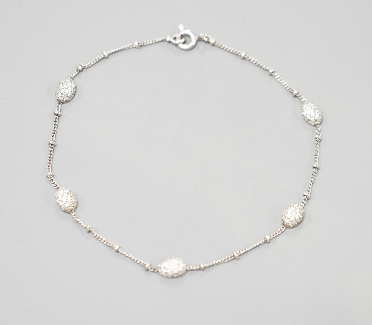 A modern 750 white metal and diamond chip set demi lune link bracelet, 19cm,gross weight 3.1 grams. - Image 3 of 4