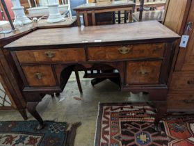 A Queen Anne revival banded walnut kneehole dressing table, width 102cm, depth 48cm, height 75cm