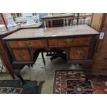 A Queen Anne revival banded walnut kneehole dressing table, width 102cm, depth 48cm, height 75cm