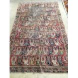 An antique Agra rug 210 x 124cm