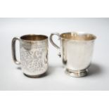 An Edwardian engraved silver christening mug, Chester, 1906, 73mm and a later silver mug, 6.5oz.