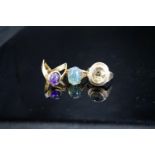 Two 9ct and gem set dress rings, gross 6.8 grams and a 333(8ct) and gem set dress ring, gross 5.6