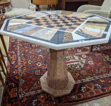 A modern octagonal specimen marble games table, width 91cm, depth 78cm