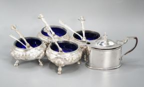 A set of four Victorian silver bun salts, Sheffield, 1869 and four associated silver spoons and a