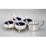 A set of four Victorian silver bun salts, Sheffield, 1869 and four associated silver spoons and a