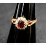 A late Victorian 18ct gold ruby and diamond cluster ring, with ruby set shoulders, size M, gross