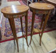 A pair of Sheraton style oval painted satinwood occasional tables, width 31cm, depth 26cm, height