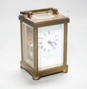 A Matthew Norman brass carriage timepiece, 15 cm high with the handle up