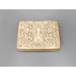 An early 19th century gold mounted ivory armorial table snuff box, 8.3 cmthe top carved with an
