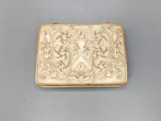 An early 19th century gold mounted ivory armorial table snuff box, 8.3 cmthe top carved with an