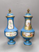 A pair of Sevres style porcelain bleu celeste ground vases and covers, 34cm