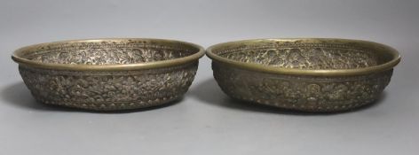 A pair of Indonesian embossed silvered metal circular bowls,Dia 22.5cm