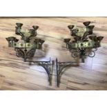 A pair of Gothic revival brass two tier wall candelabra, projection 50cm, 68 cm high
