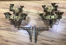 A pair of Gothic revival brass two tier wall candelabra, projection 50cm, 68 cm high