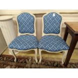 A pair of modern French painted upholstered side chairs