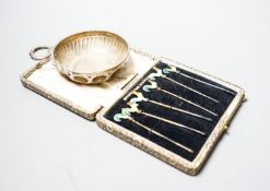 A 1930's silver taste vin and a cased set of six sterling and enamel cocktail sticks.