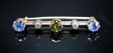 A yellow metal, single stone garnet?, two stone Ceylon sapphire and two stone diamond chip set bar