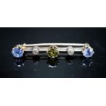 A yellow metal, single stone garnet?, two stone Ceylon sapphire and two stone diamond chip set bar