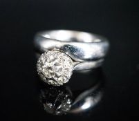 A modern 18ct white gold and diamond cluster ring, now soldered together with an 18ct white metal