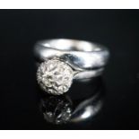 A modern 18ct white gold and diamond cluster ring, now soldered together with an 18ct white metal