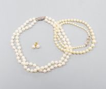 A single strand graduated cultured pearl necklace, with diamond set 9ct clasp, 43cm, a double strand
