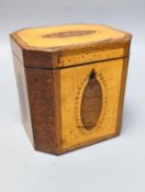 A George III octagonal sycamore and rosewood panelled tea caddy. 13cm