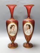 A pair of Bohemian enamelled and overlaid cranberry glass vases, 19th century 35cm