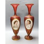 A pair of Bohemian enamelled and overlaid cranberry glass vases, 19th century 35cm