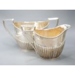 A late Victorian fluted silver cream jug and matching sugar bowl, by Walker & Hall, Sheffield,