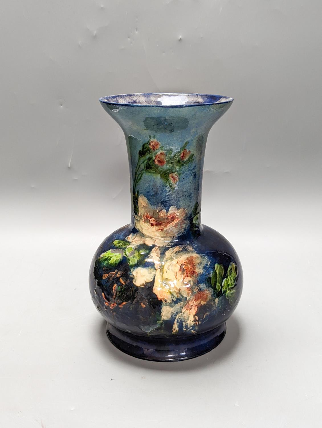 A continental floral painted vase, possibly Belgian. Stamped to underside. 26cm