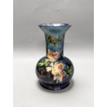 A continental floral painted vase, possibly Belgian. Stamped to underside. 26cm