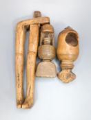 A pair of Georgian treen ‘riding boot’ nutcrackers, 14.5cm and two 19th century acorn-shaped Treen