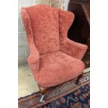 A Queen Anne style upholstered wingback armchair, width 78cm, depth 77cm, height 102cm