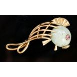 A Viennese 585 yellow metal, hardstone and cabochon ruby set brooch, modelled as a stylised fish,