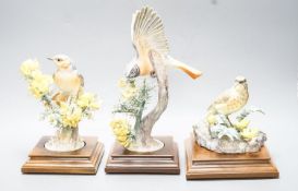 Three Royal Worcester porcelain groups of birds, modelled by Dorothy Doughty - ‘’Redstart and