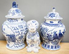 2 modern Chinese blue and white vases and covers and a similar model of a dog.