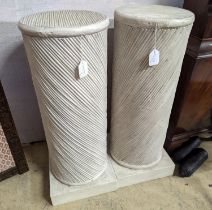 A pair of painted spiral moulded columns, Colefax & Fowler, diameter 30cm, height 79cm