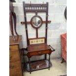 A late Victorian tile-backed mahogany wash stand, width 84cm, depth 34cm, height 184cm