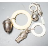 Four assorted child's silver teething rattles, including dog, bear and acorn.