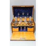A Victorian burr walnut, ‘satinwood’ and coromandel decanter box 39.5cmcontaining various drinking