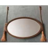 An Art Deco style oval wall mirror, width 74cm, height 43cm