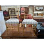 A pair of Regency simulated bamboo gilt wood side chairs with striped seats