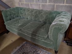 A late Victorian Chesterfield settee upholstered in buttoned green fabric, length 194cm, depth 80cm,